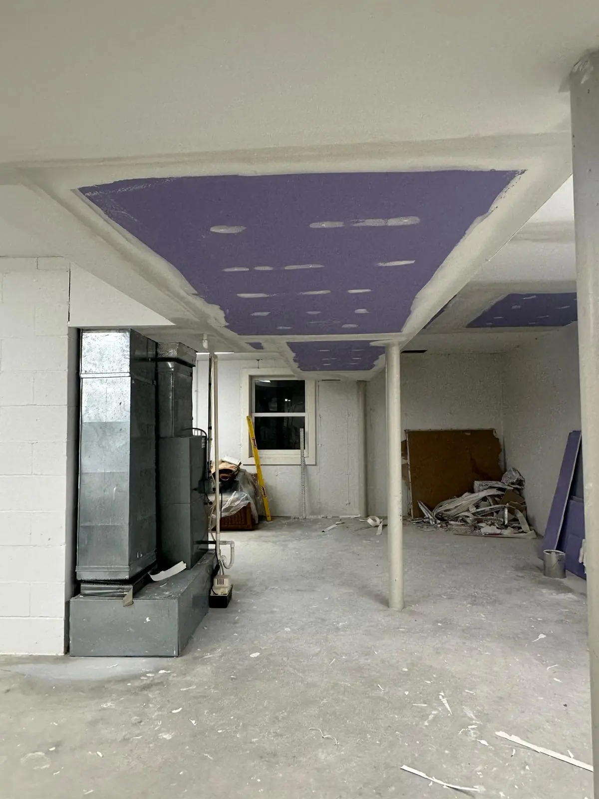New moisture-resistant drywall taped and ready for mudding